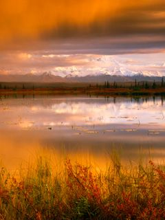 Sunset Clouds Over a Tundra Pond