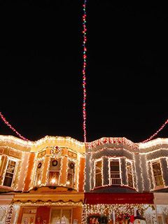 Christmas lights adorn the row houses