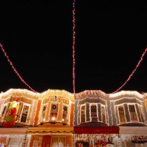 Christmas lights adorn the row houses