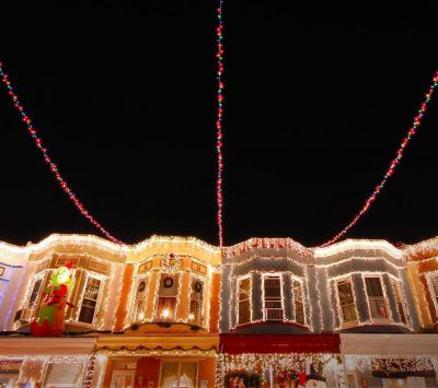 Christmas lights adorn the row houses